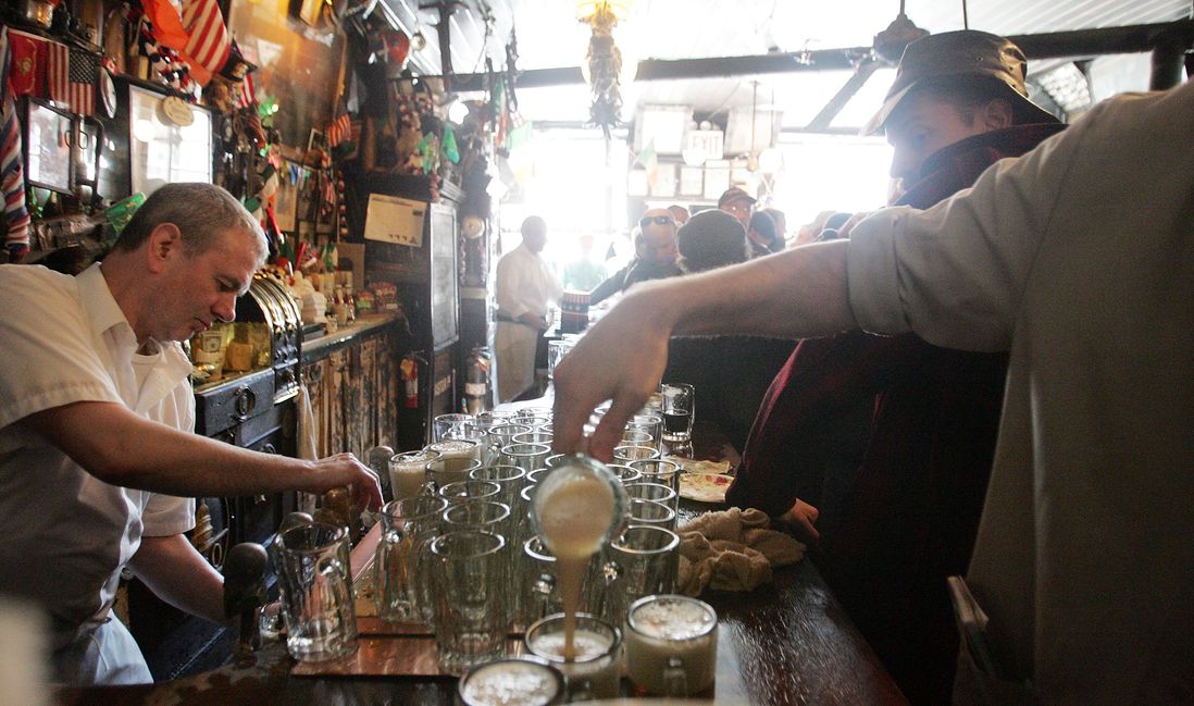 A waiter pours beer in McSorley's Old Ale House as it celebrates its 152nd anniversary February 17, 2006. (Getty)